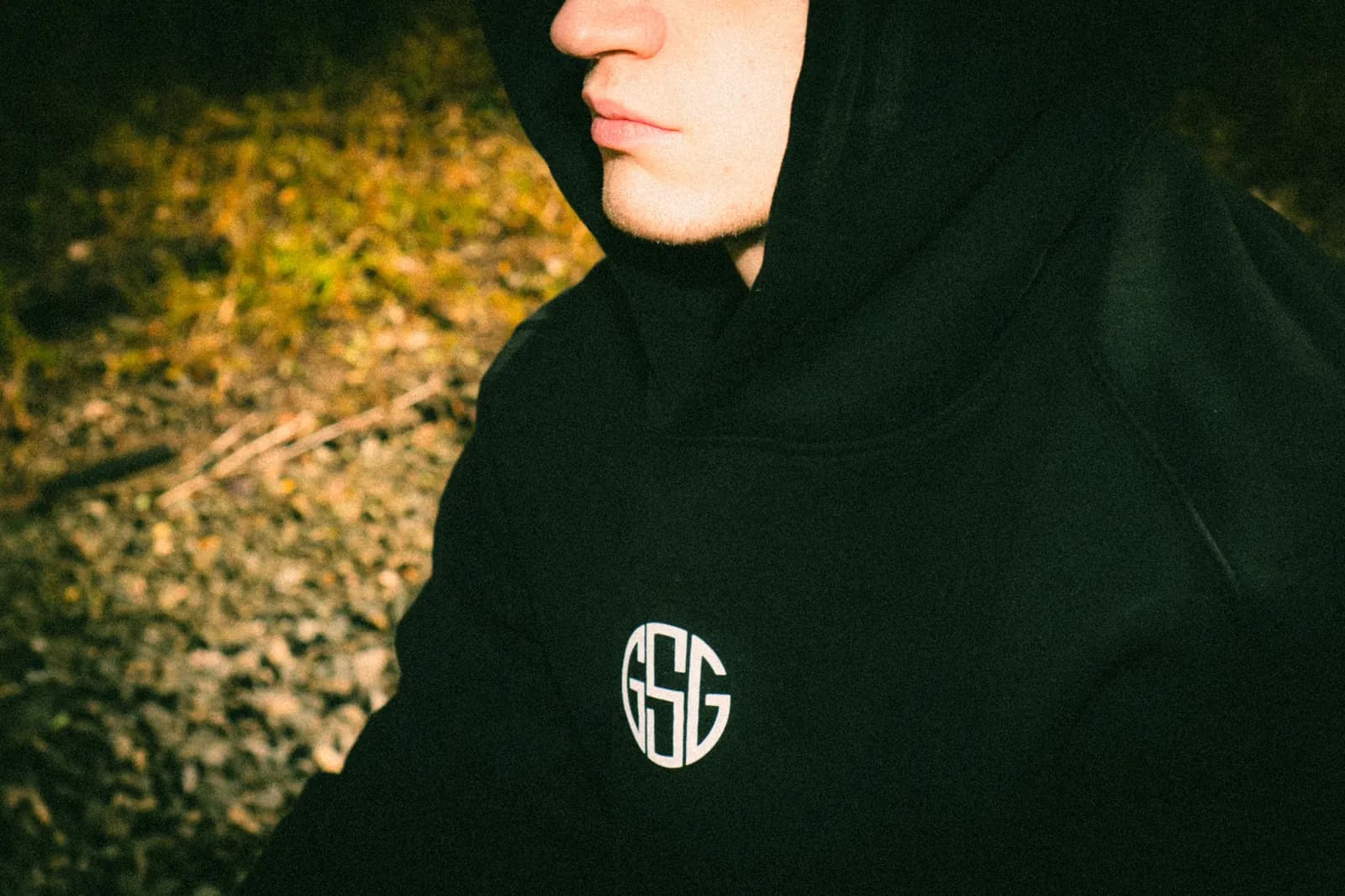The Reaper hoodie in black, close-up of the GSG chest logo