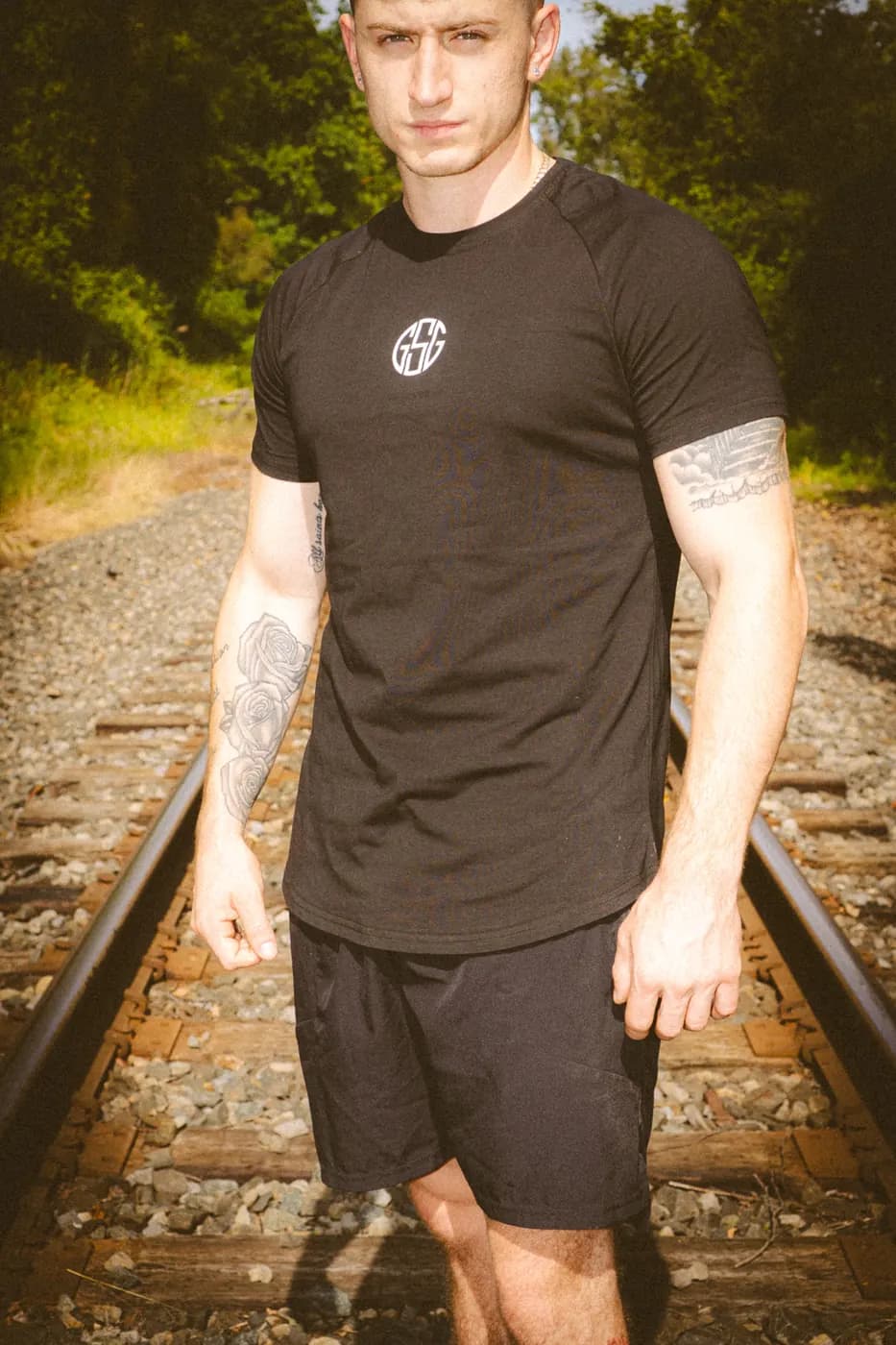 The Pilot gym tee in black, fitted through the chest and arms
